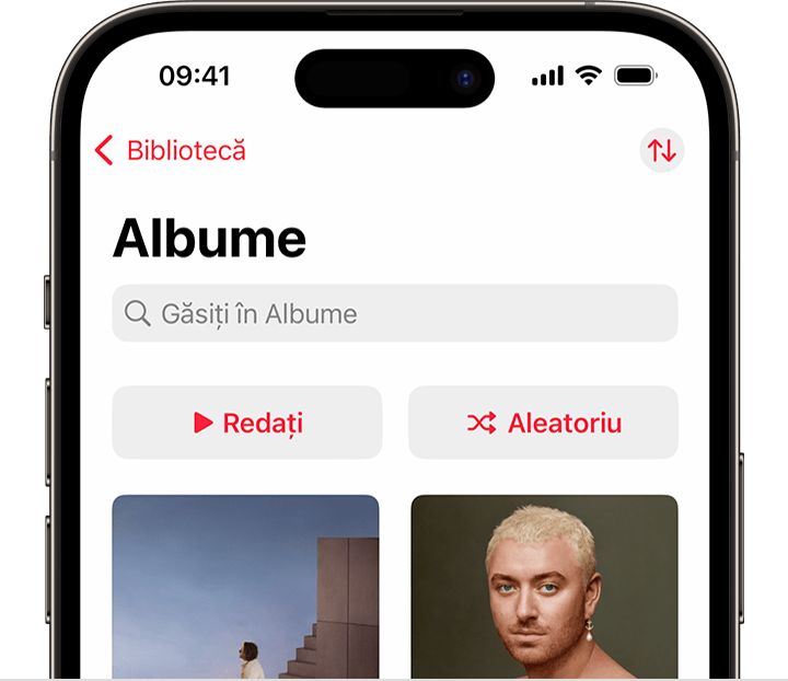 iPhone care afișează butonul Redare aleatorie în partea de sus a albumelor, în fila Bibliotecă a aplicației Apple Music
