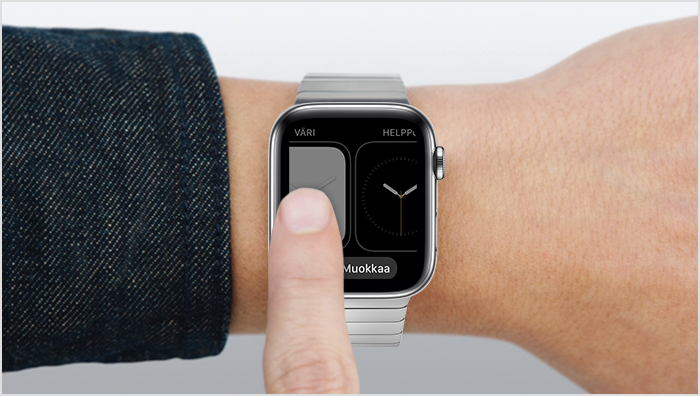 Henkilö pyyhkäisee sormella Apple Watchin näytössä
