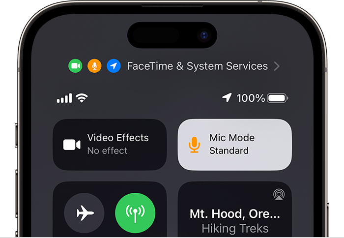 An iPhone screen with Control Centre open, showing the Mic Mode button.