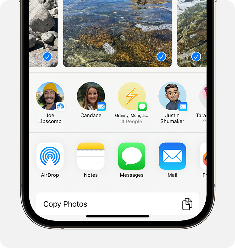 An iPhone showing the share sheet with photos selected and the AirDrop option displayed.
