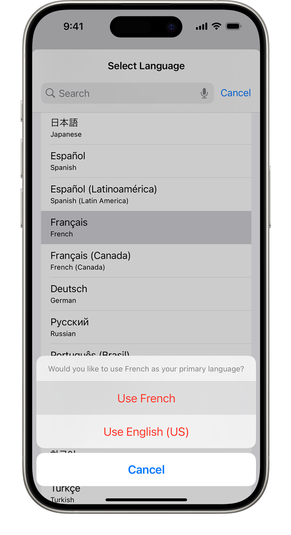 „iPhone“ rodomas įspėjimas: „Would you like to use French as your primary language?“ (ar norite naudoti prancūzų kalbą kaip pagrindinę kalbą?) Rodomos šios parinktys: „Use French“ (naudoti prancūzų kalbą), „Use English (US)“ (naudoti anglų kalbą (JAV) ir „Cancel“ (atšaukti).