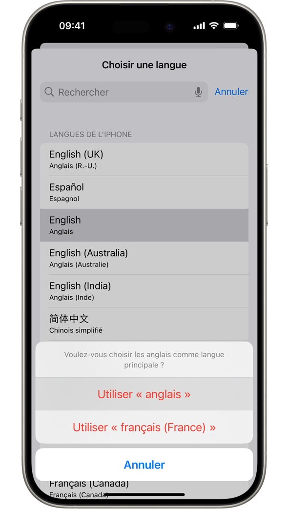 Un iPhone affichant une alerte disant : « Voulez-vous utiliser le français comme langue principale ? » Les options affichées sont Utiliser le français, Utiliser l’anglais (États-Unis) et Annuler.