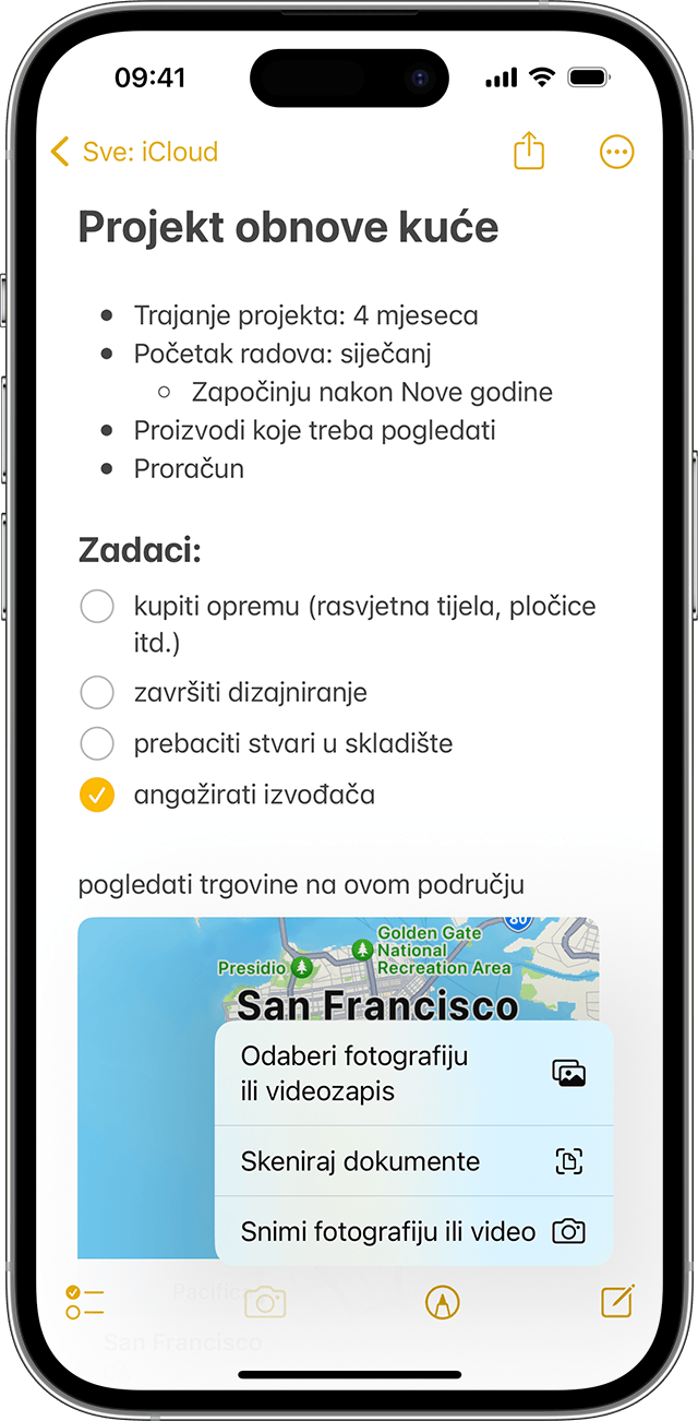 iPhone na kojem se prikazuje kako dodati fotografiju ili videozapis u bilješku u aplikaciji Bilješke.
