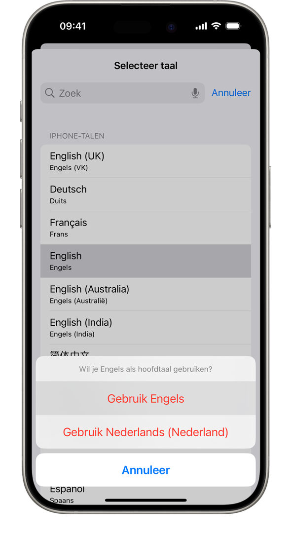Een iPhone met een bericht met de vraag 'Wil je Frans als hoofdtaal gebruiken?' De getoonde opties zijn 'Gebruik Frans', 'Gebruik Engels (VS)' en 'Annuleer'.