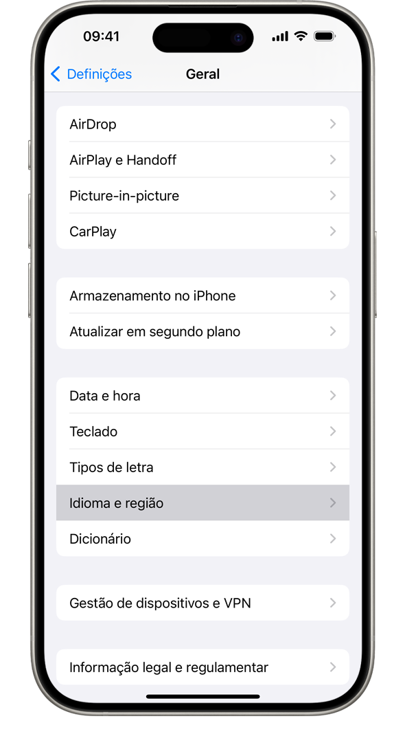 Um iPhone a mostrar o menu de definições gerais, com a opção Idioma e região realçada.