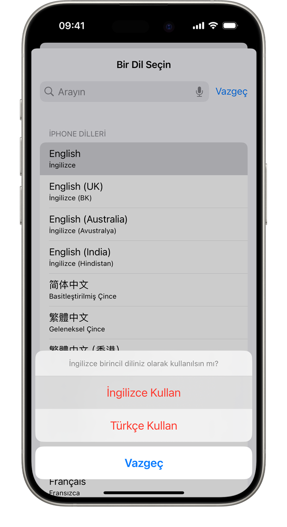 "Fransızca birincil diliniz olarak kullanılsın mı?" uyarısını gösteren iPhone. Gösterilen seçenekler Kullan: Fransızca, Kullan: İngilizce (ABD) ve Vazgeç'tir.