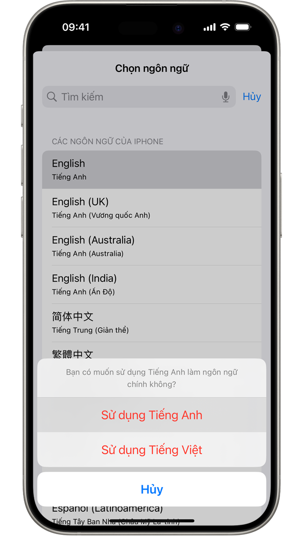 Một chiếc iPhone hiển thị cảnh báo: "Bạn có muốn sử dụng tiếng Pháp làm ngôn ngữ chính không?" Các lựa chọn bao gồm Sử dụng tiếng Pháp, Sử dụng tiếng Anh (Mỹ) và Hủy.
