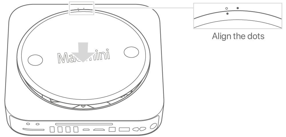 Underside of Mac mini showing bottom cover in unlocked position