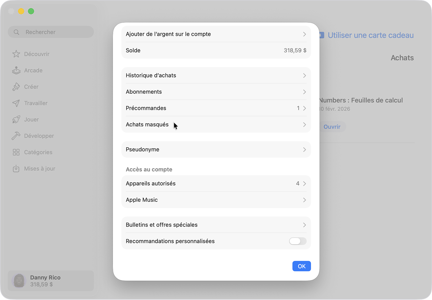 L’App Store sur Mac qui affiche l’écran Réglages du compte, avec l’option Manage hidden items (Gérer les éléments masqués) en surbrillance.