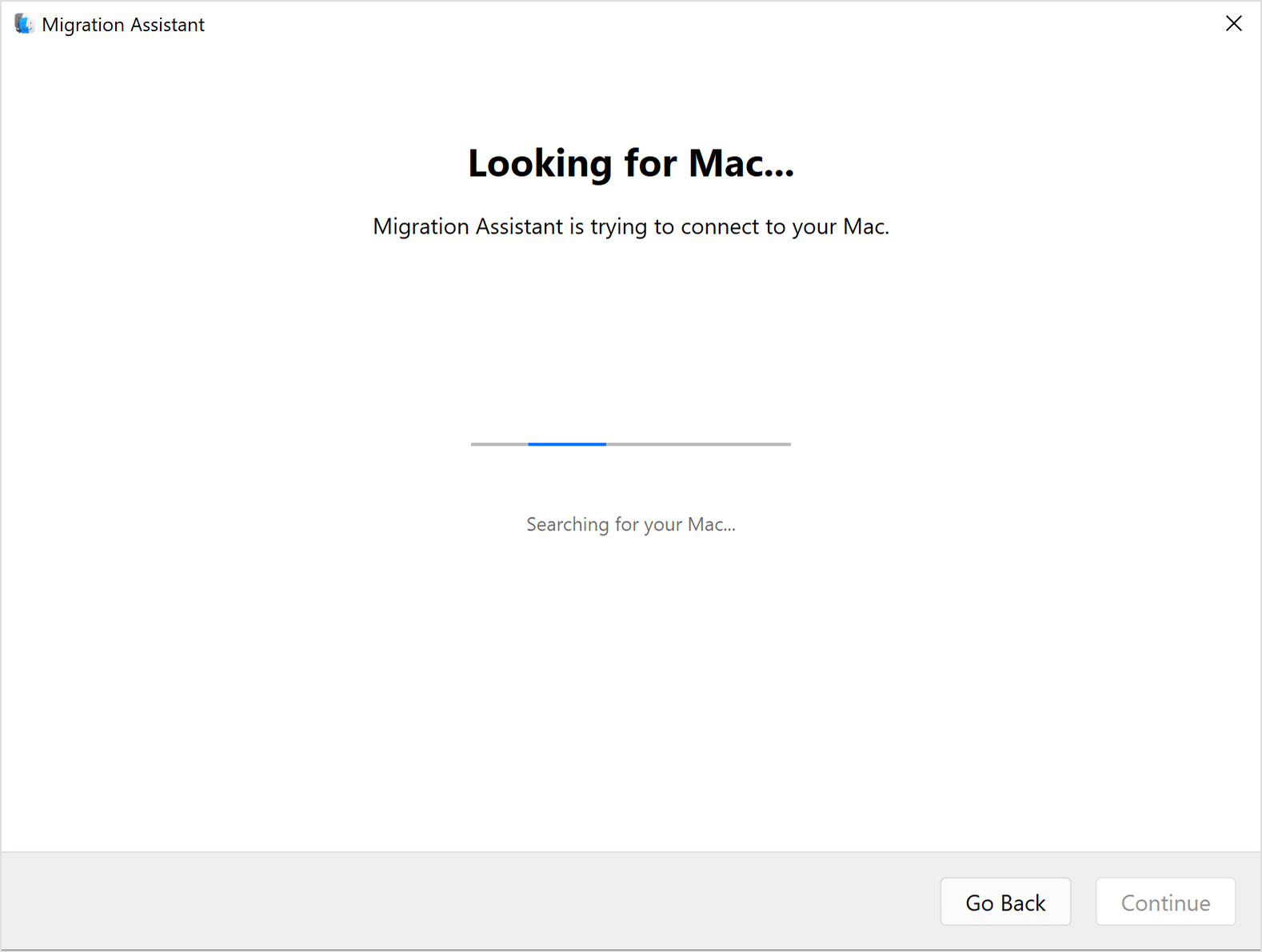 PC 上的“迁移助理”：“Looking for Mac...”（正在查找 Mac...）